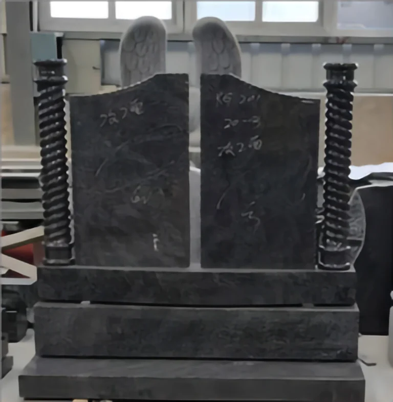 Double granite headstone with decorative columns and inscriptions