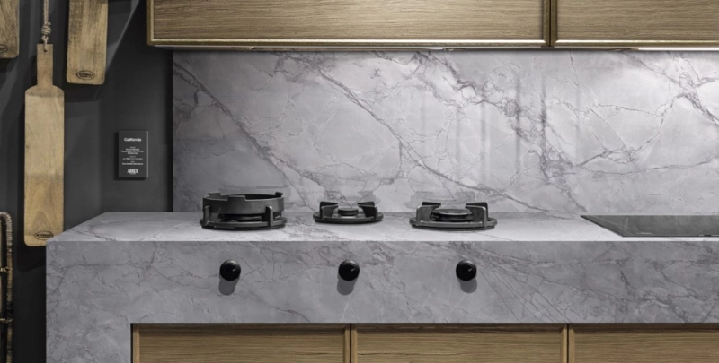 Sophisticated grey sintered stone kitchen surface with veining.