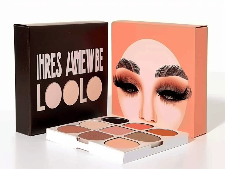 Multicolored eyeshadow palette with a bold face design on the packaging, featuring a mix of warm and neutral shades.